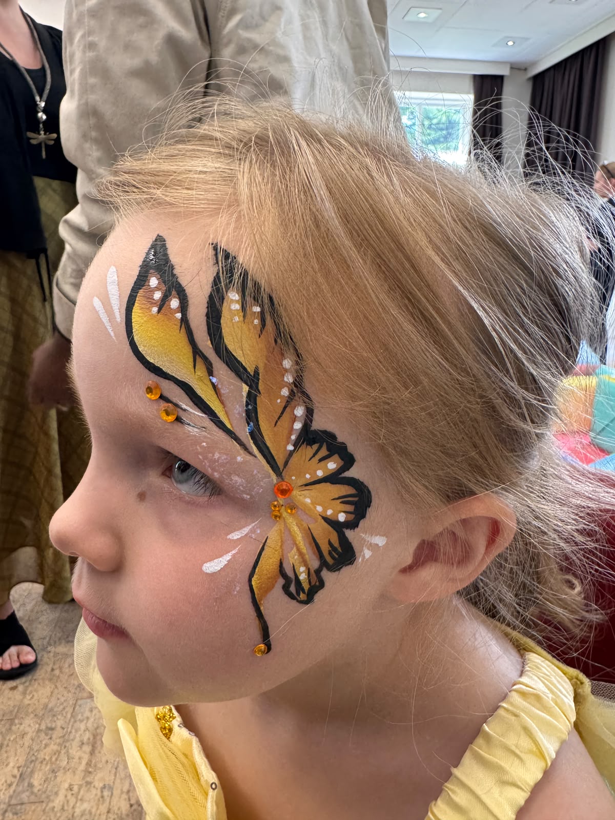 Yellow butterfly face painting